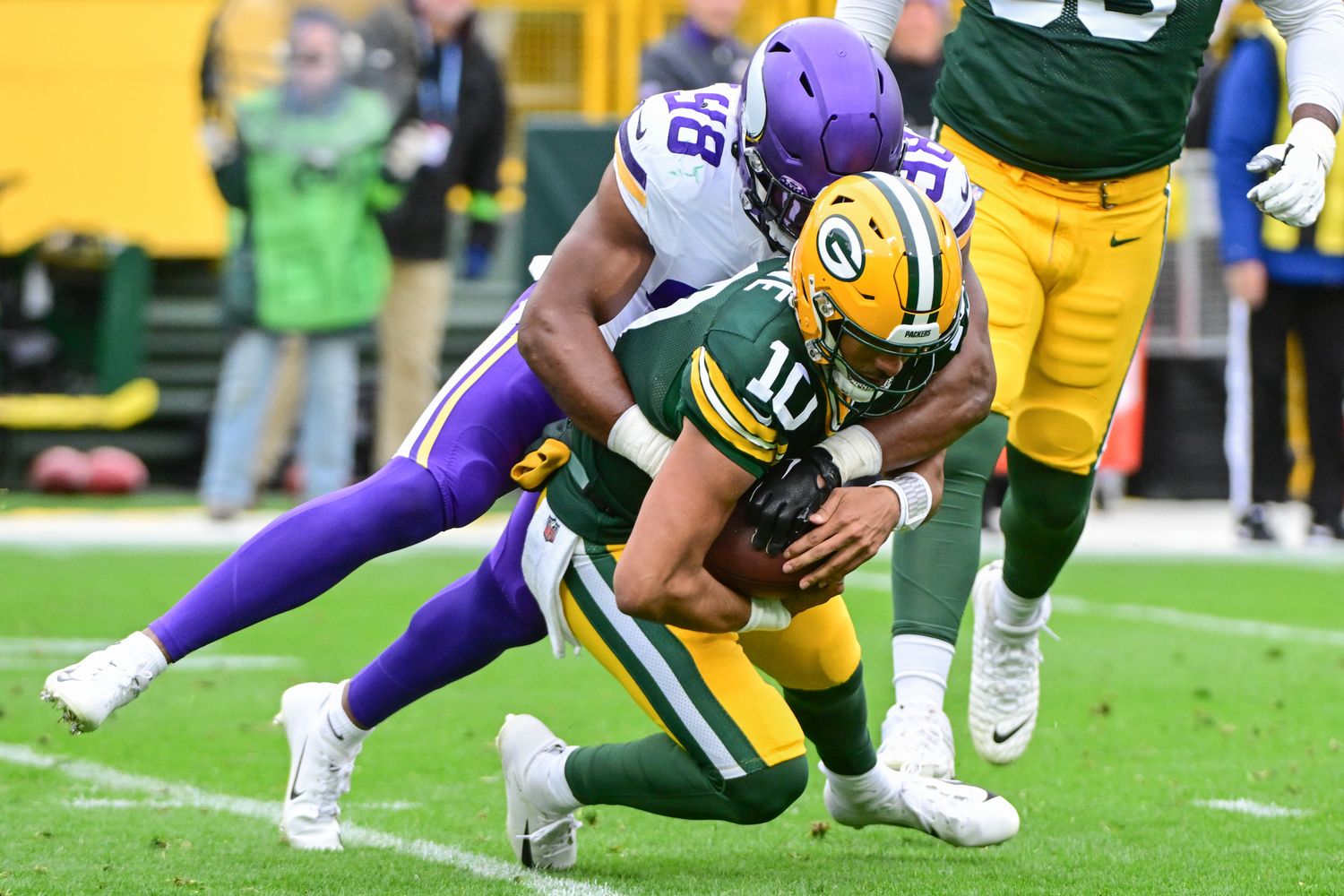 Jordan Love is sacked by Vikings defensive end DJ Wonnum.
